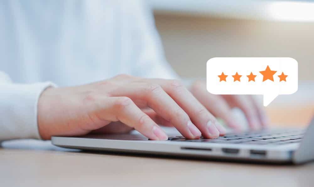 Customer Man Hand Typing Keyboard Laptop Giving Good Score Point Review Service With Star Rating Feedback 1